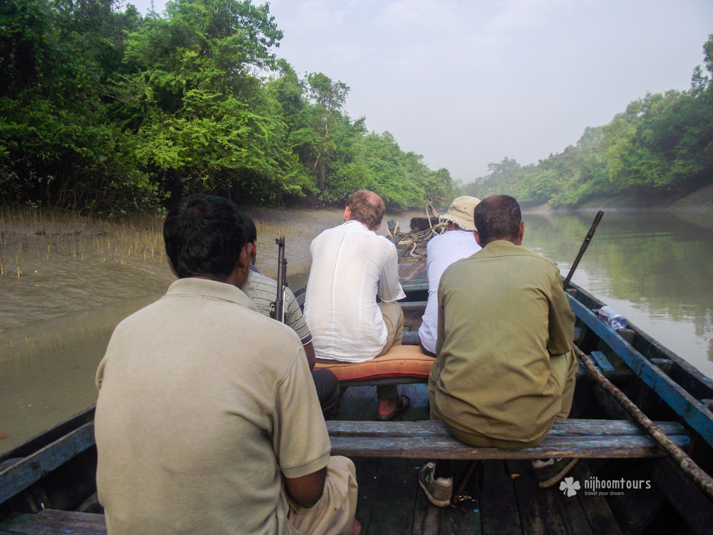 Morning boat ride at a narrow canal in Sundarbans Mangrove Forest
