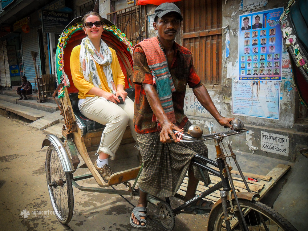 Riding rickshaw on the street of Dhaka. One of the best things to do in Dhaka.