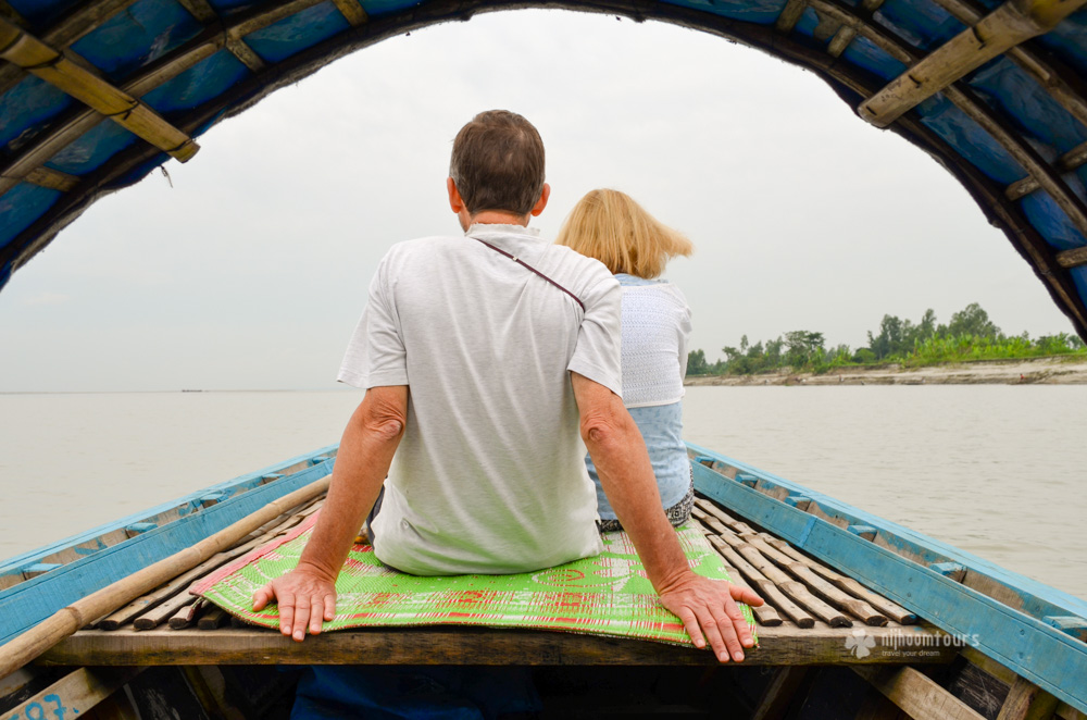Jackie & Mike Hulton riding a boat on Meghna river