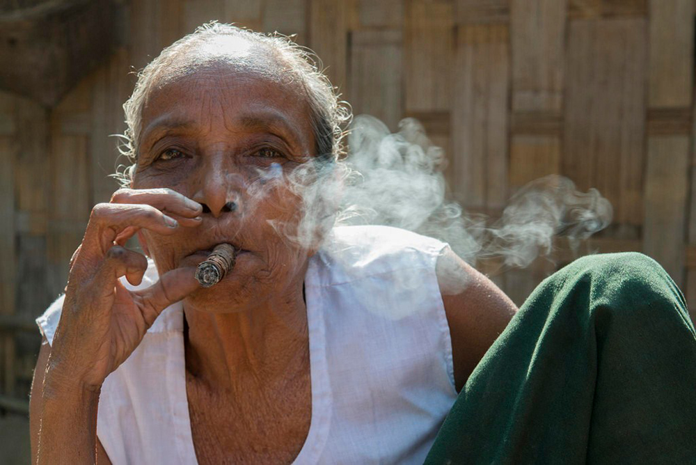 A Marma lady smoking churut