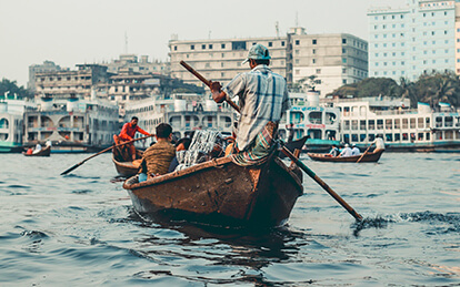 A photo of lively and vibrant Sadarghat waterfront in Dhaka City Tour Package - New & Old Dhaka tour